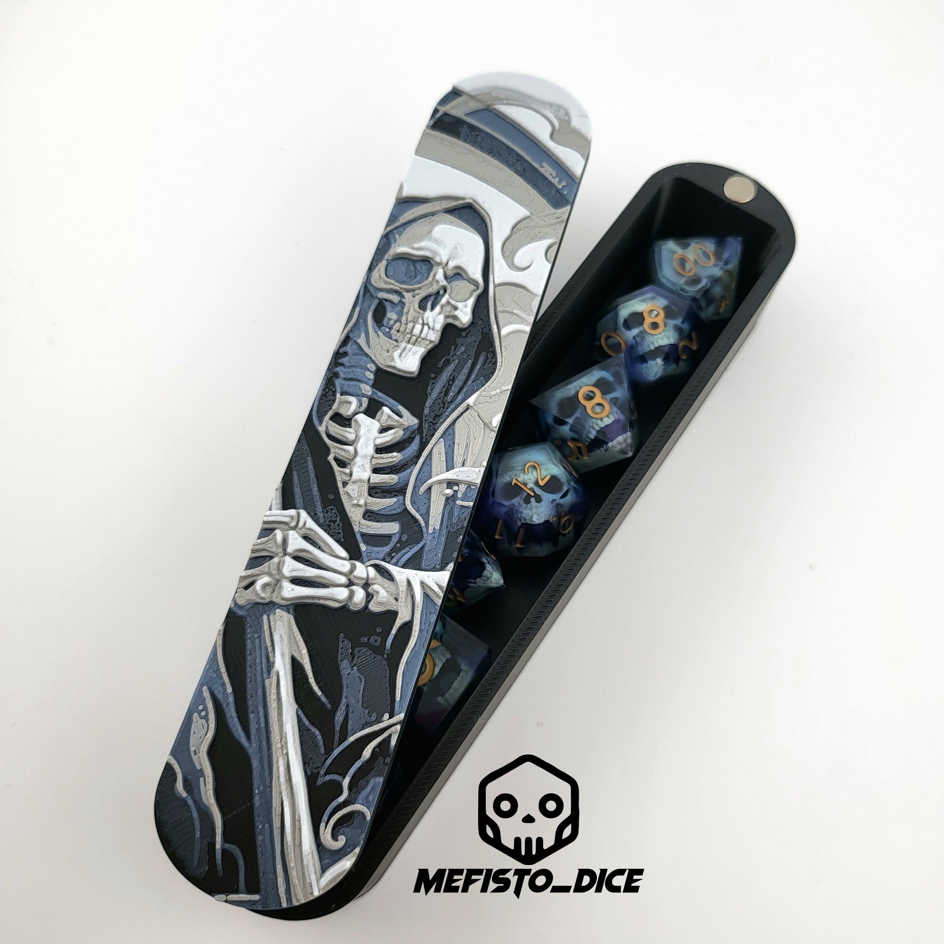Close-up of a dice box featuring a detailed skeleton reaper illustration in shades of grey and blue, designed for storing RPG dice, handcrafted by Mefisto_Dice.