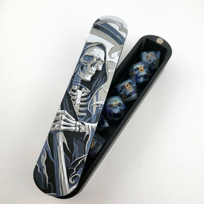 Close-up of a dice box featuring a detailed skeleton reaper illustration in shades of grey and blue, designed for storing RPG dice, handcrafted by Mefisto_Dice.