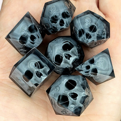 Black translucent polyhedral resin dice set with embedded red skulls inside, perfect for D&D (Dungeons & Dragons) and dark fantasy tabletop RPG campaigns