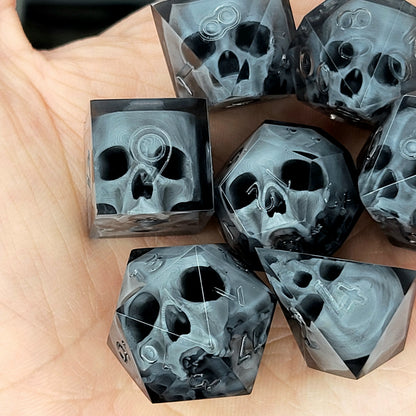 Black translucent polyhedral resin dice set with embedded red skulls inside, perfect for D&D (Dungeons & Dragons) and dark fantasy tabletop RPG campaigns
