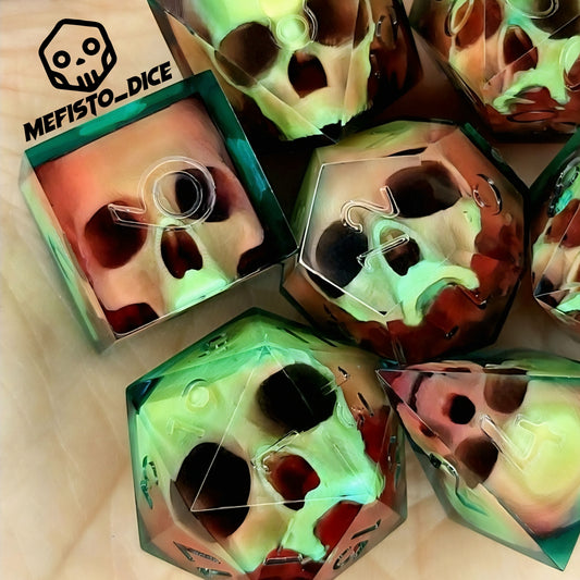 Handmade sharp edge resin dice set with floating skull design in transparent green and red resin