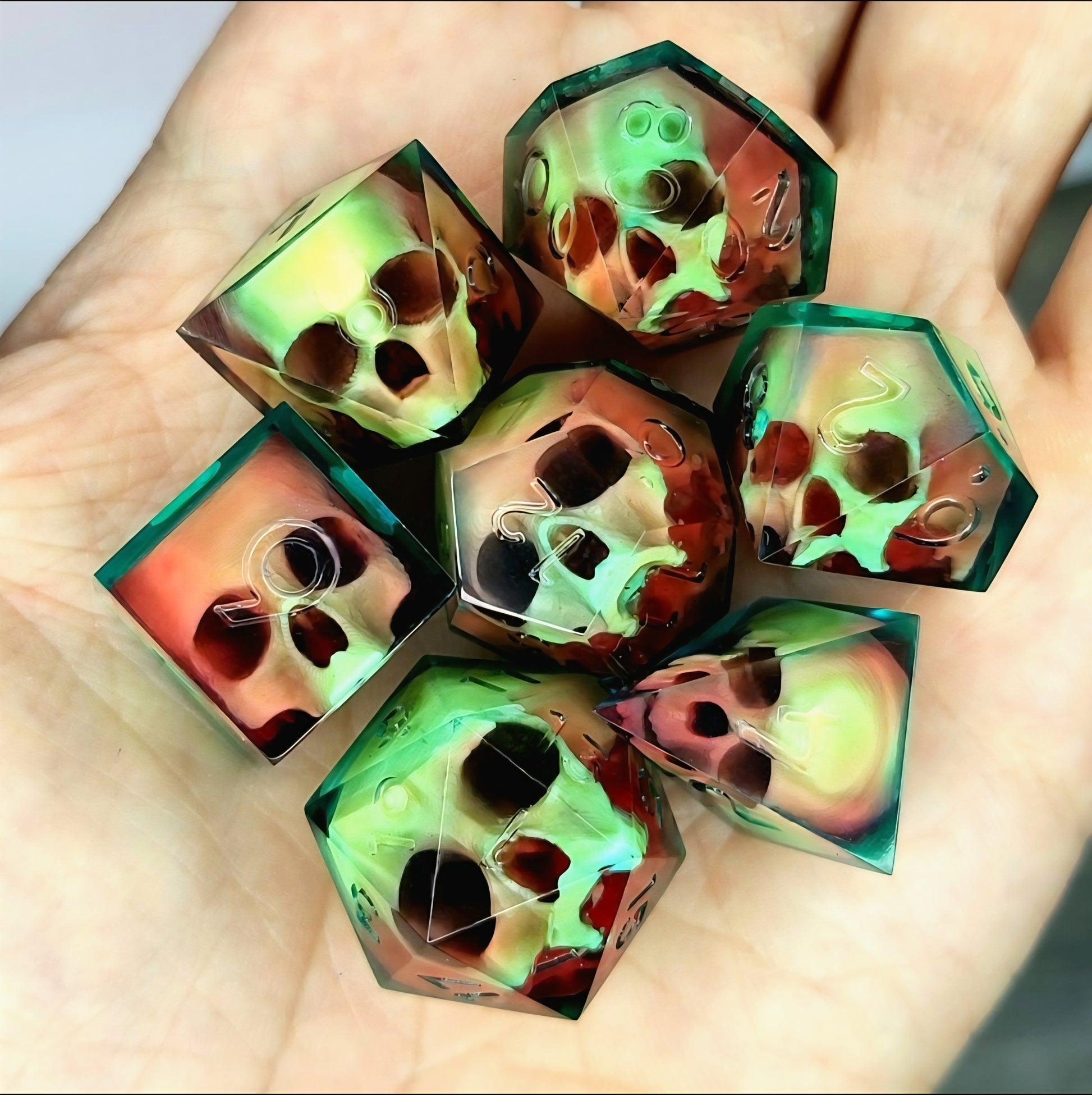 Handmade sharp edge resin dice set with floating skull design in transparent green and red resin