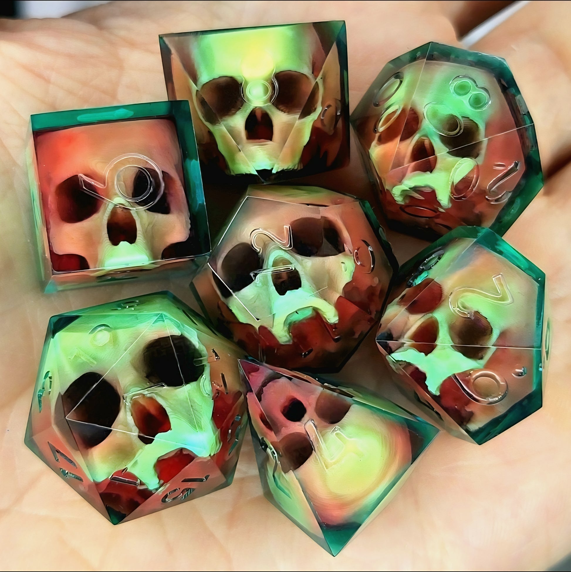 Handmade sharp edge resin dice set with floating skull design in transparent green and red resin