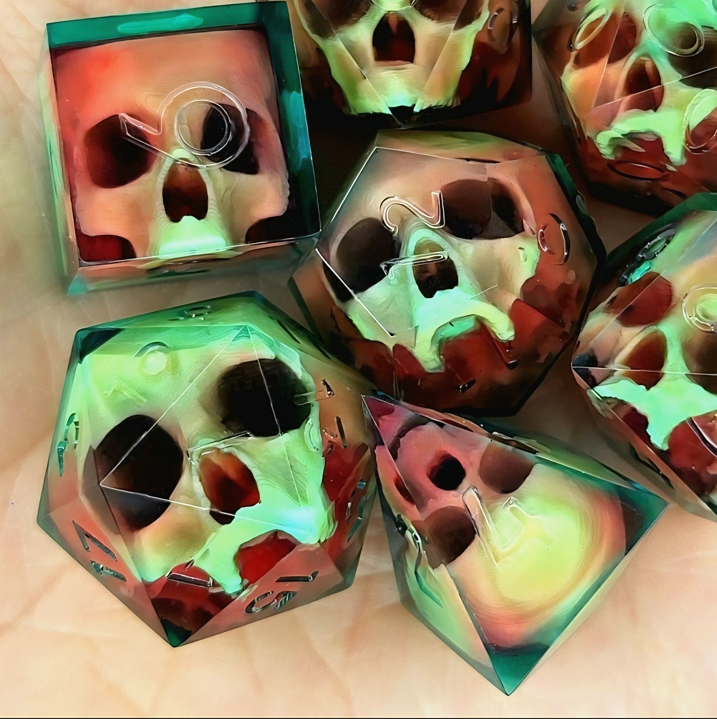 Handmade sharp edge resin dice set with floating skull design in transparent green and red resin