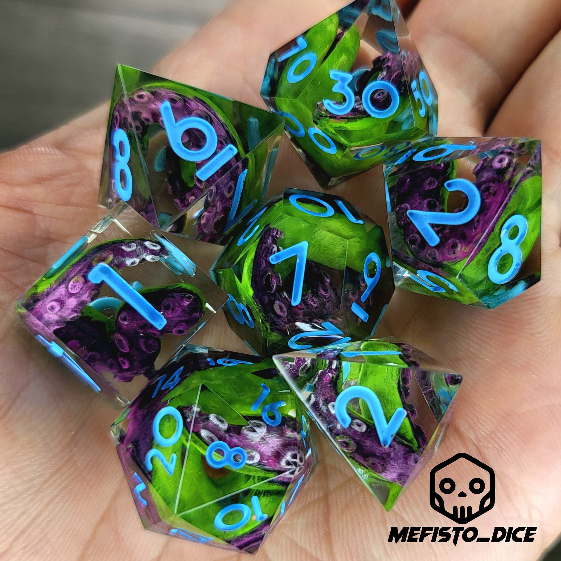 Dice set with green and purple tentacles inside and blue numbers for play dnd , dungeons and dragons
