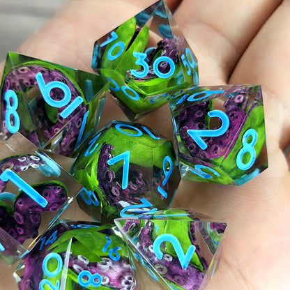 Dice set with green and purple tentacles inside and blue numbers for play dnd , dungeons and dragons