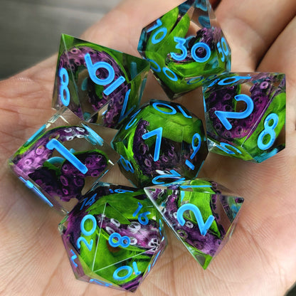 Dice set with green and purple tentacles inside and blue numbers for play dnd , dungeons and dragons