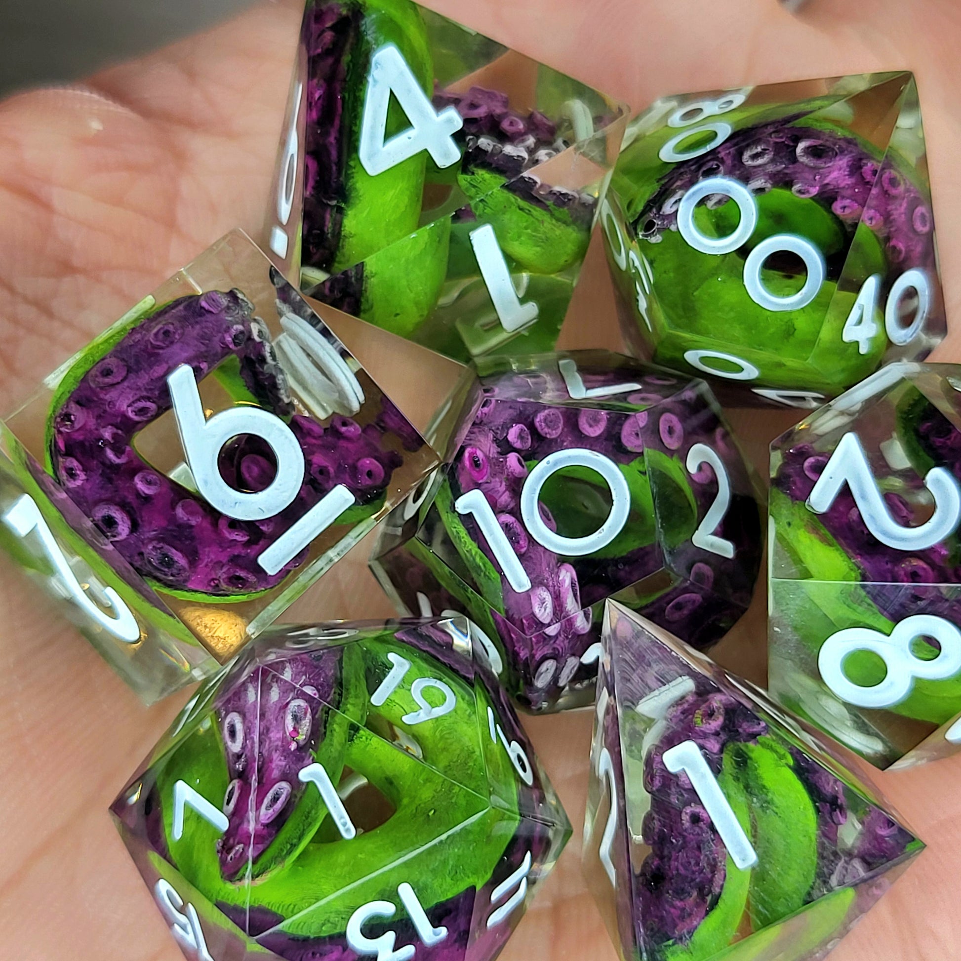 Dice set with green tentacles inside and white numbers for play dnd , dungeons and dragons