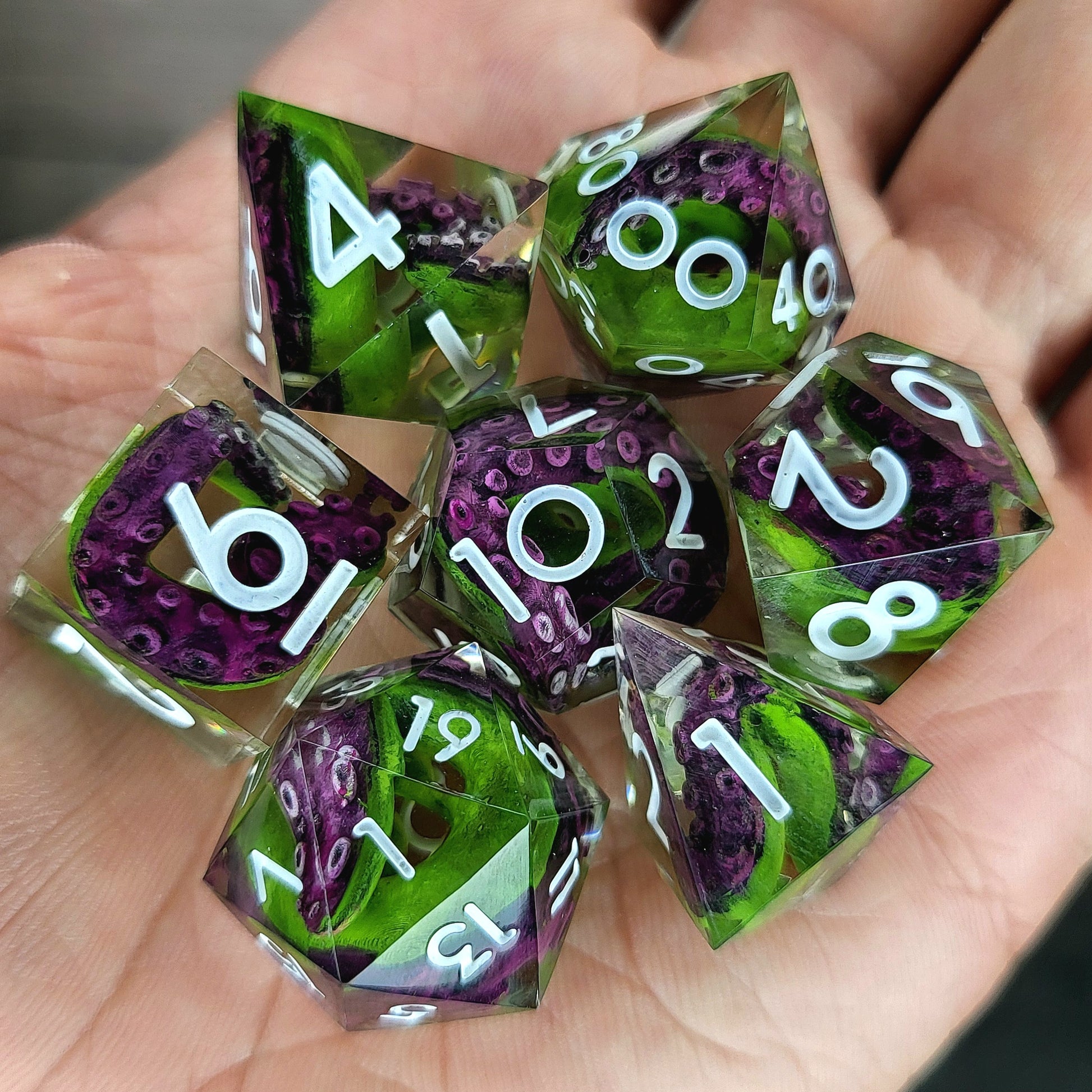 Dice set with green tentacles inside and white numbers for play dnd , dungeons and dragons