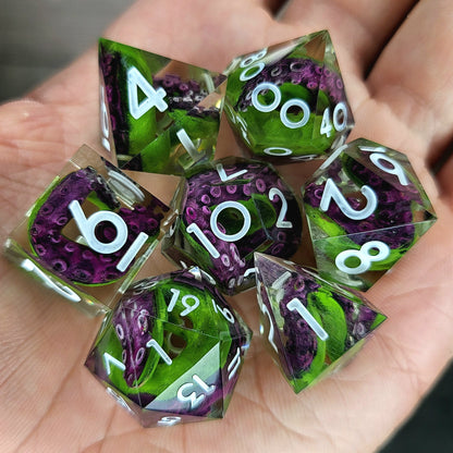 Dice set with green tentacles inside and white numbers for play dnd , dungeons and dragons