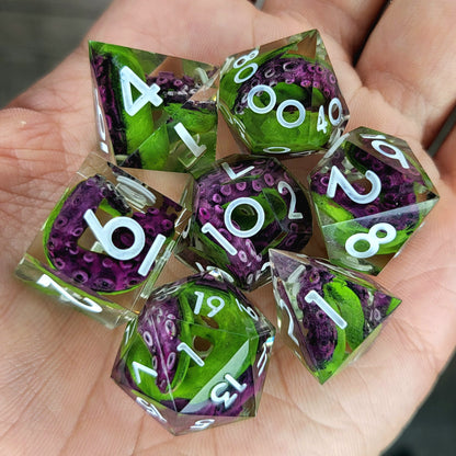 Dice set with green tentacles inside and white numbers for play dnd , dungeons and dragons