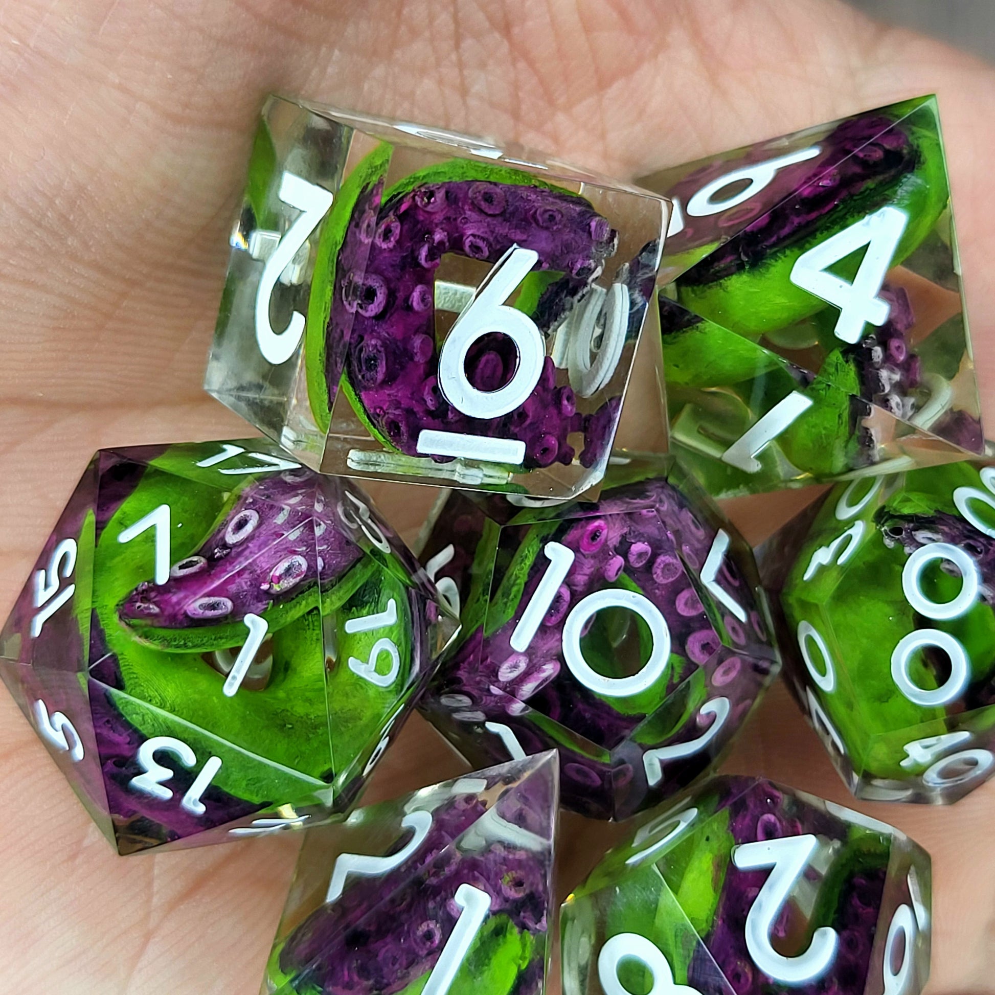 Dice set with green tentacles inside and white numbers for play dnd , dungeons and dragons