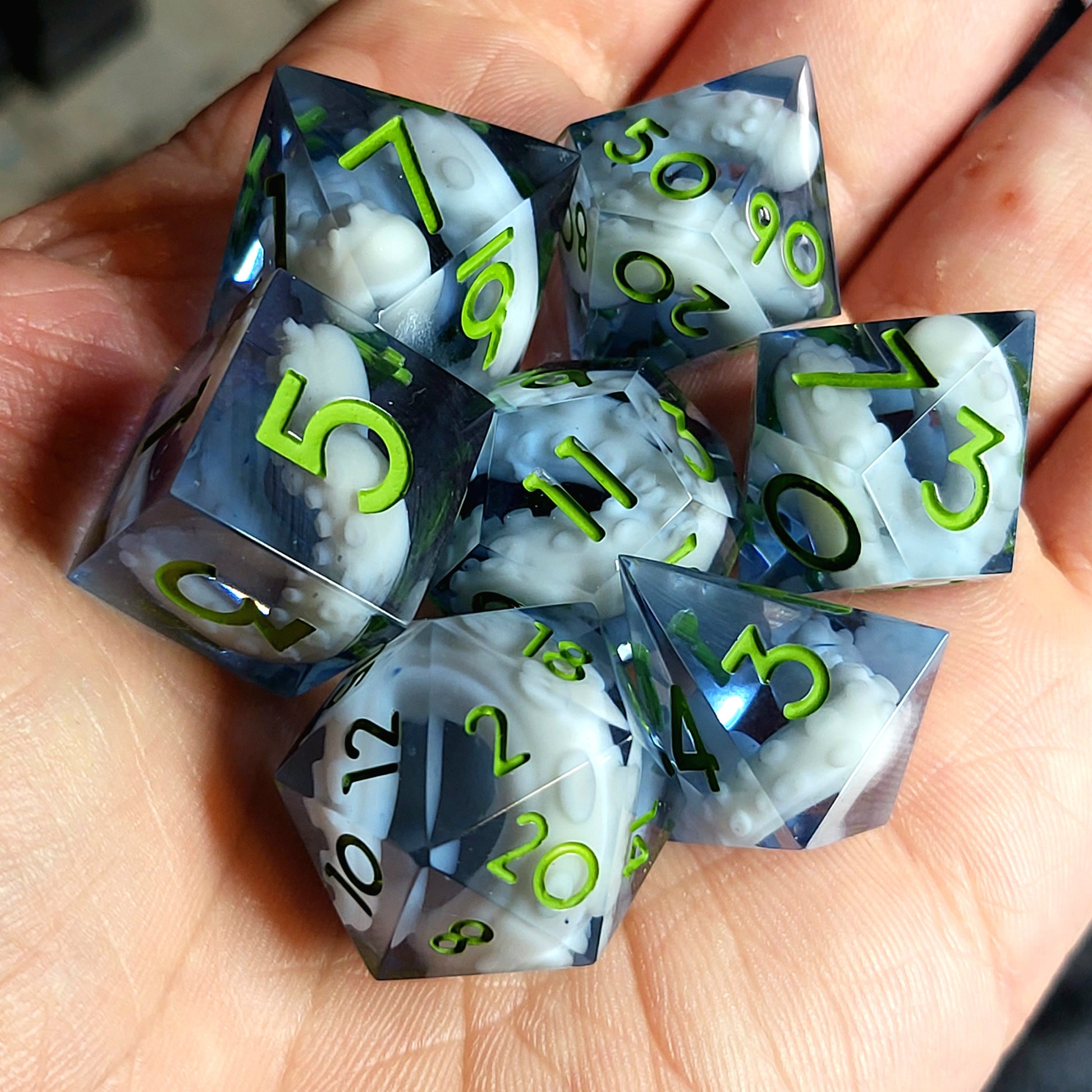 Dice set with white tentacles inside and green numbers for play dnd , dungeons and dragons and Call of Cthulhu