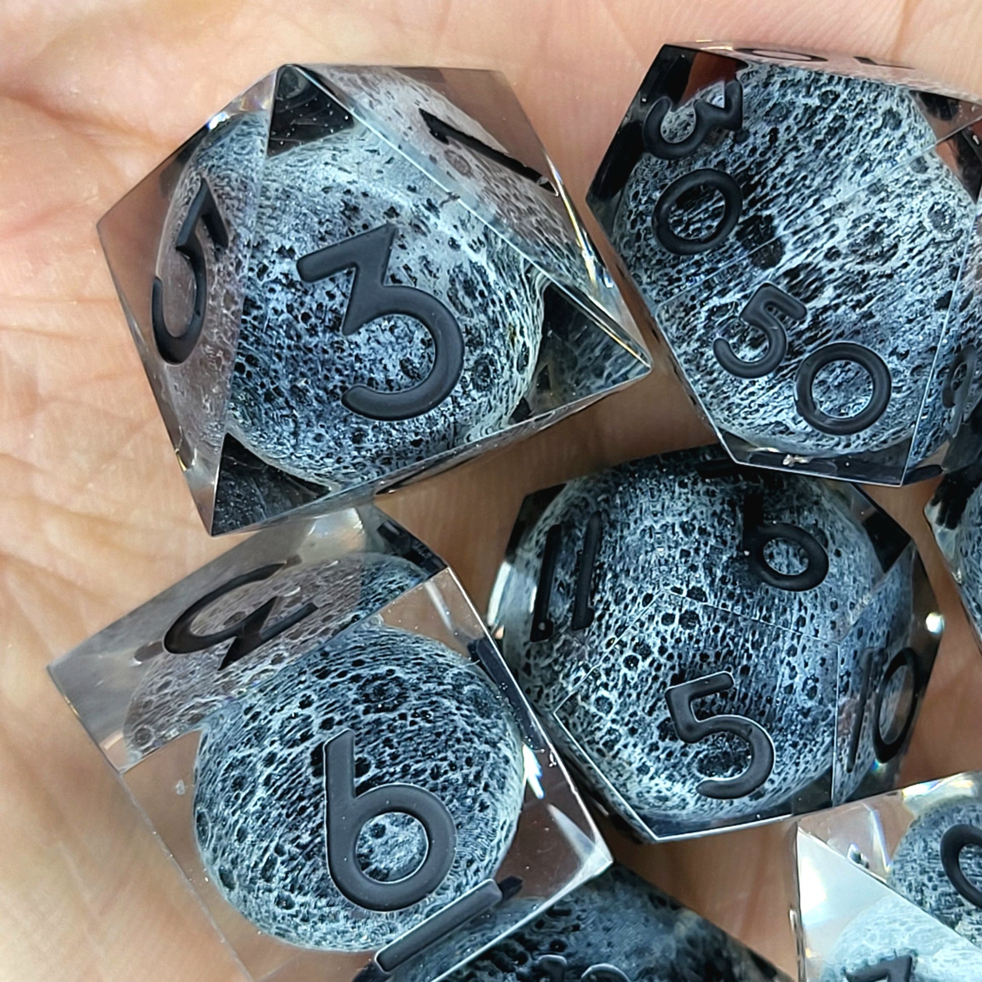 Dice set with moon inside and black numbers for play dnd , dungeons and dragons