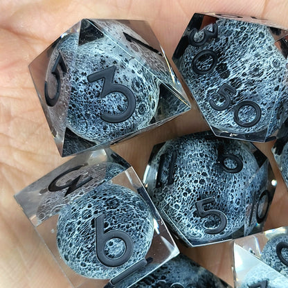 Dice set with moon inside and black numbers for play dnd , dungeons and dragons