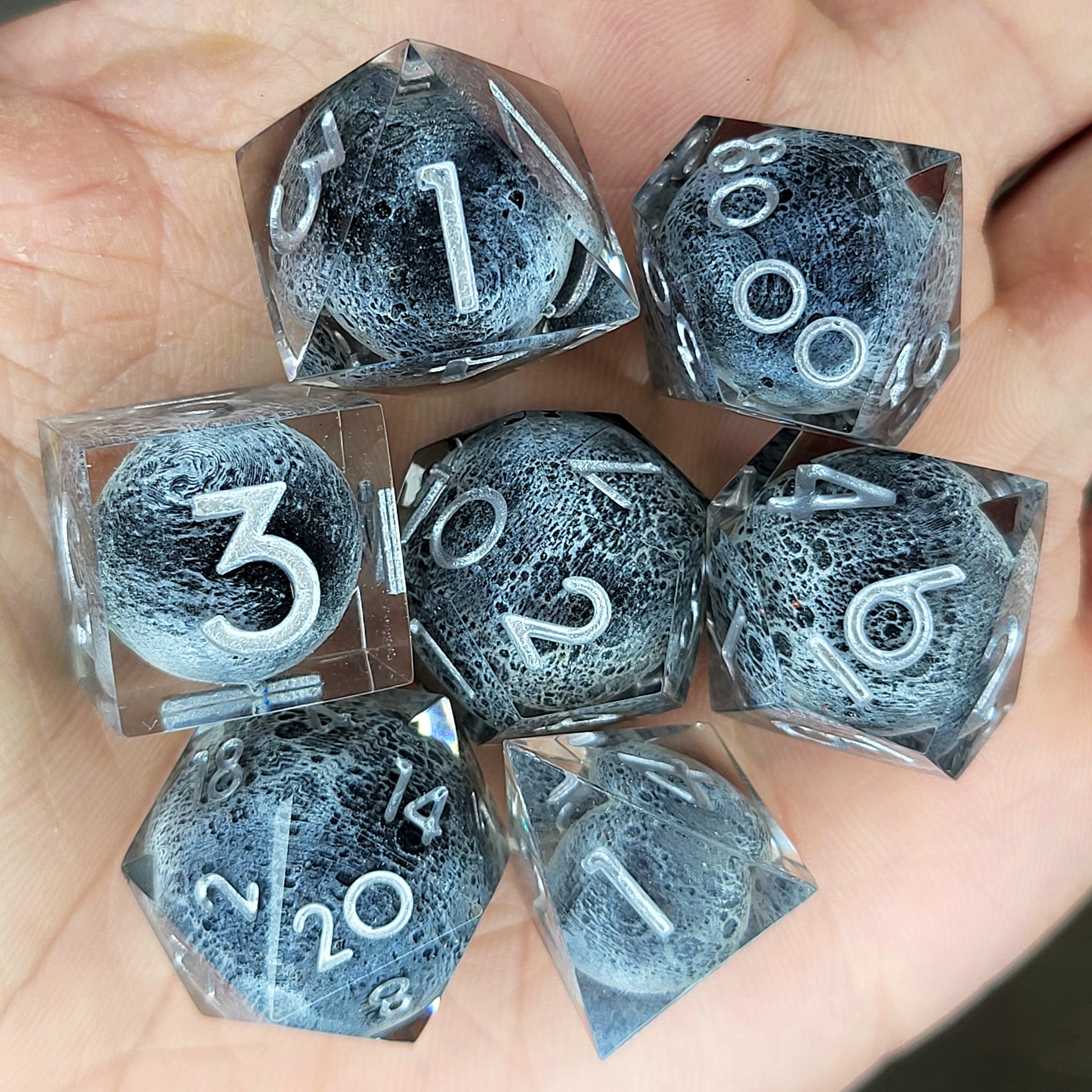 Dice set with moon inside and silver numbers for play dnd , dungeons and dragons