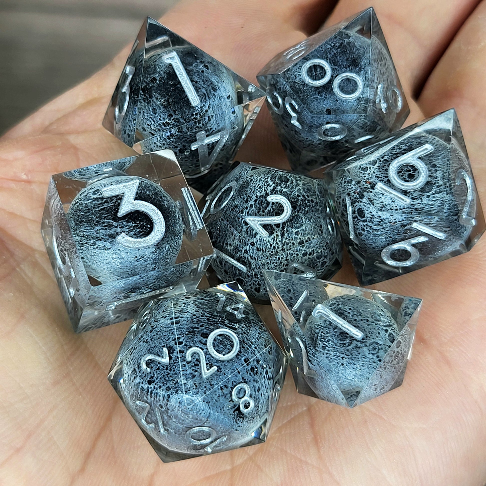 Dice set with moon inside and silver numbers for play dnd , dungeons and dragons