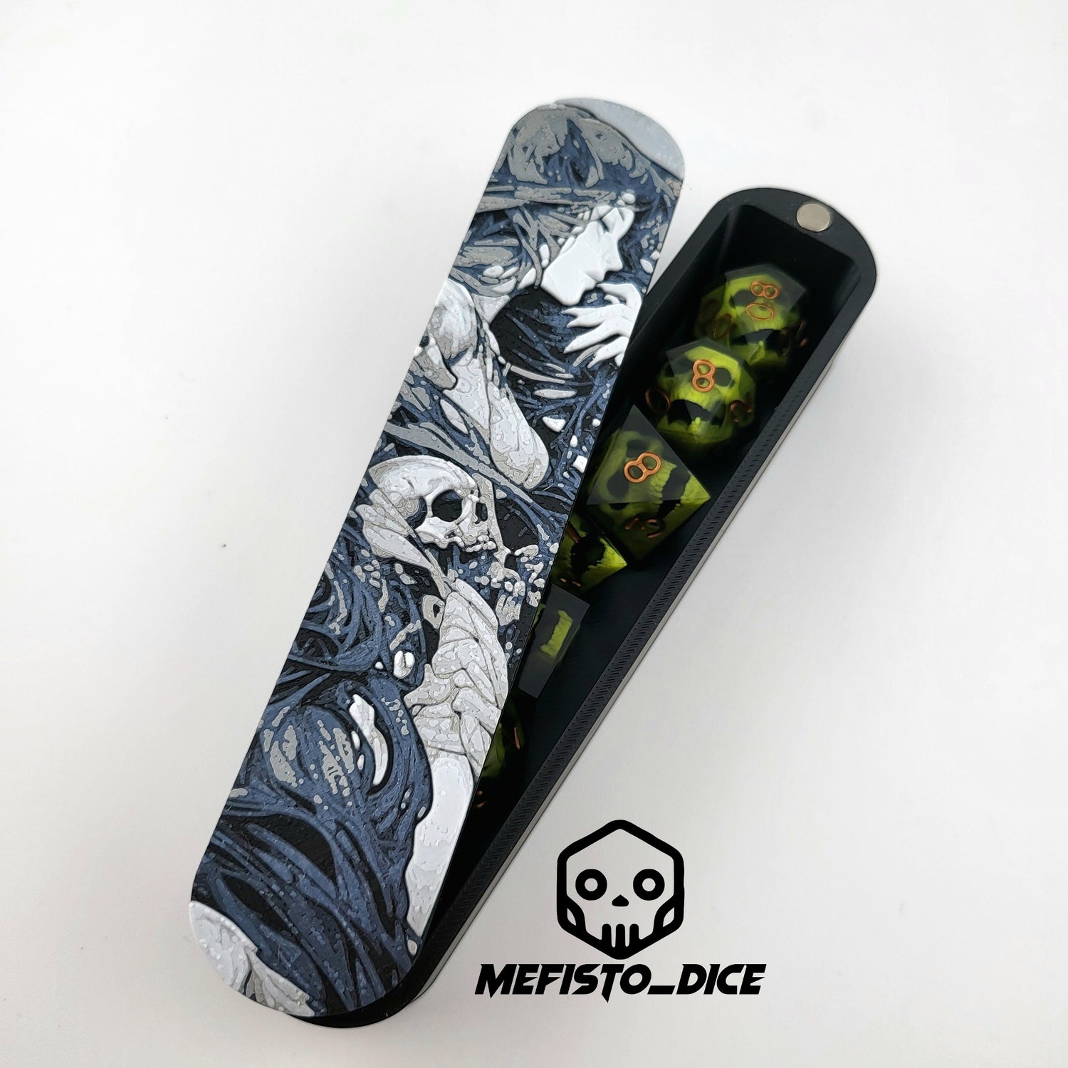 Close-up of a dice box featuring a detailed dark fantasy illustration of a woman surrounded by swirling shadows and skull motifs, shown partially open with RPG dice stored inside, designed by Mefisto_Dice.