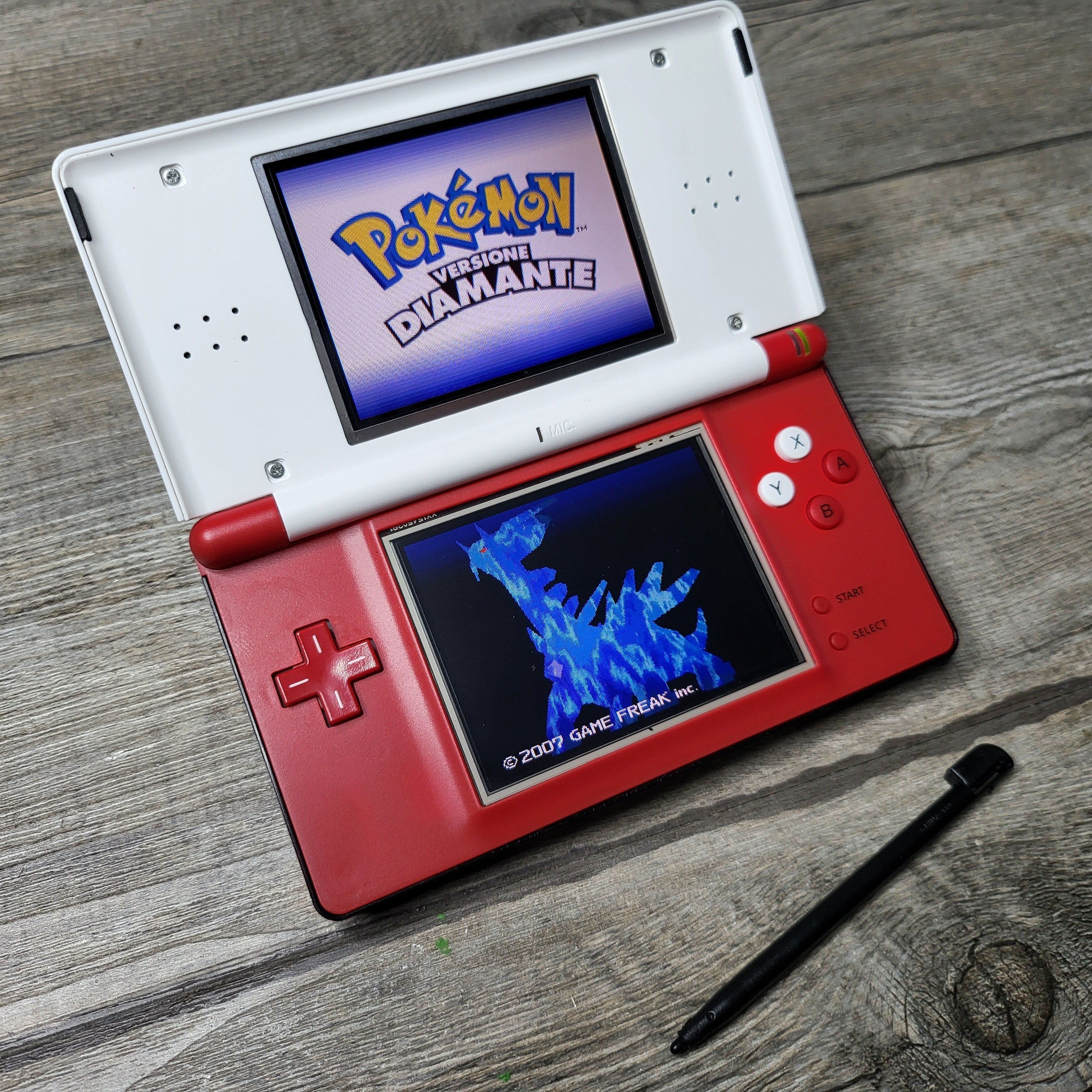 Nintendo DS lite with selling Pokémon games.