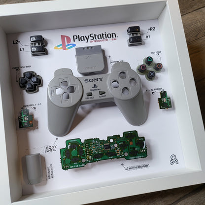 Shadow Box 10x10 with wood frame and polycarbonate glass for wall and Tabletop containing a disassembled controller for Playstation and Nintendo