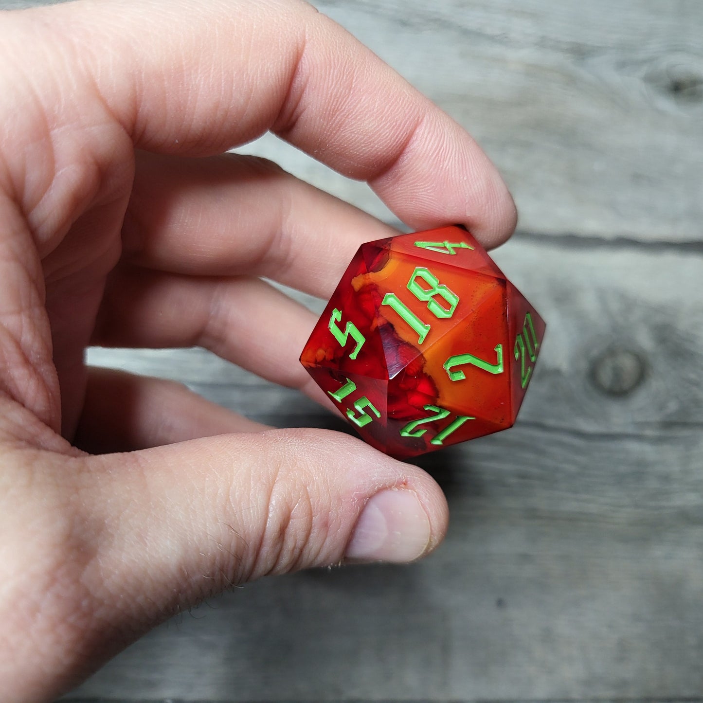 D20 dice in 33 mm format with skull inside for role-playing games for Dungeons and Dragons