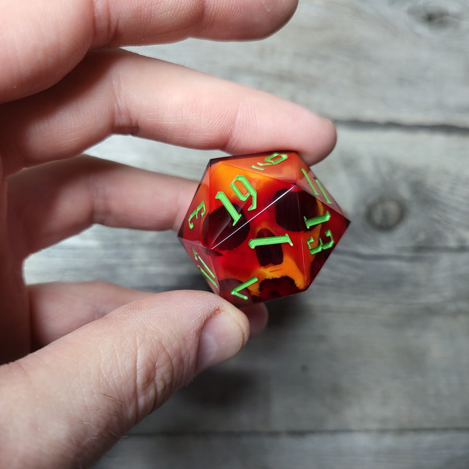 D20 dice in 33 mm format with skull inside for role-playing games for Dungeons and Dragons