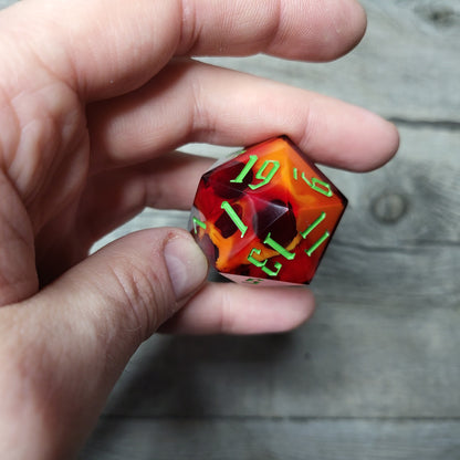 D20 dice in 33 mm format with skull inside for role-playing games for Dungeons and Dragons