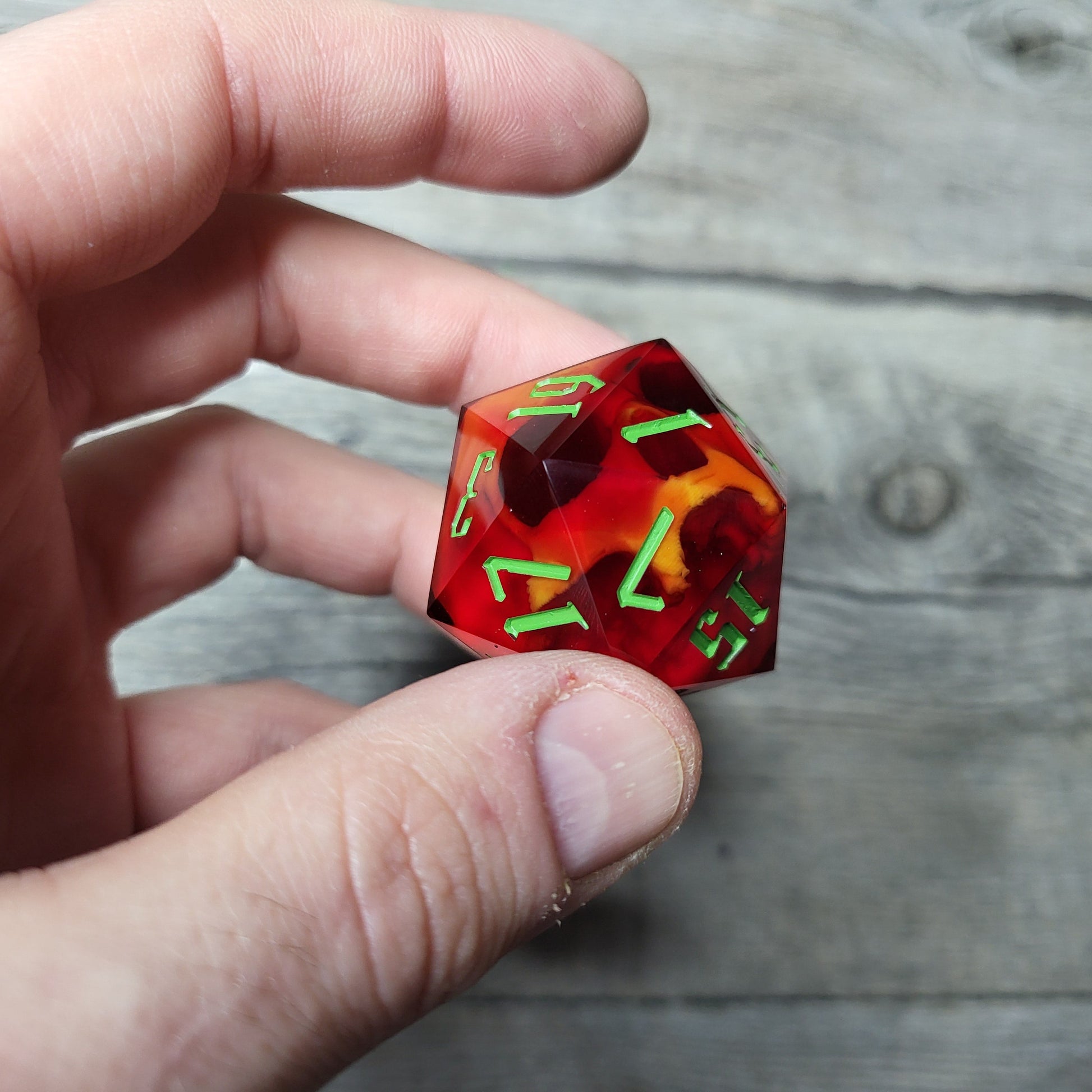 D20 dice in 33 mm format with skull inside for role-playing games for Dungeons and Dragons