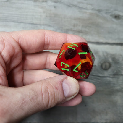 D20 dice in 33 mm format with skull inside for role-playing games for Dungeons and Dragons