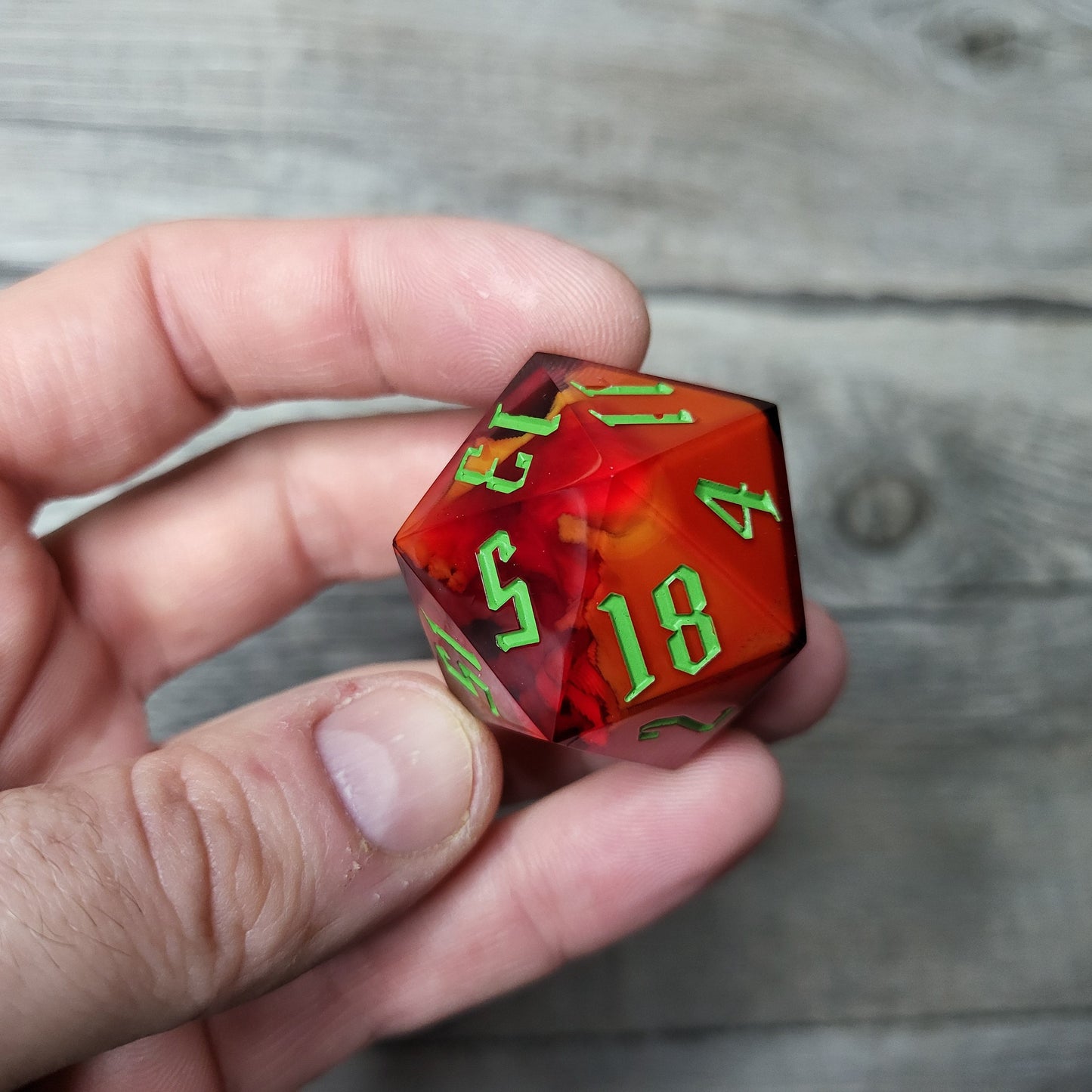 D20 dice in 33 mm format with skull inside for role-playing games for Dungeons and Dragons