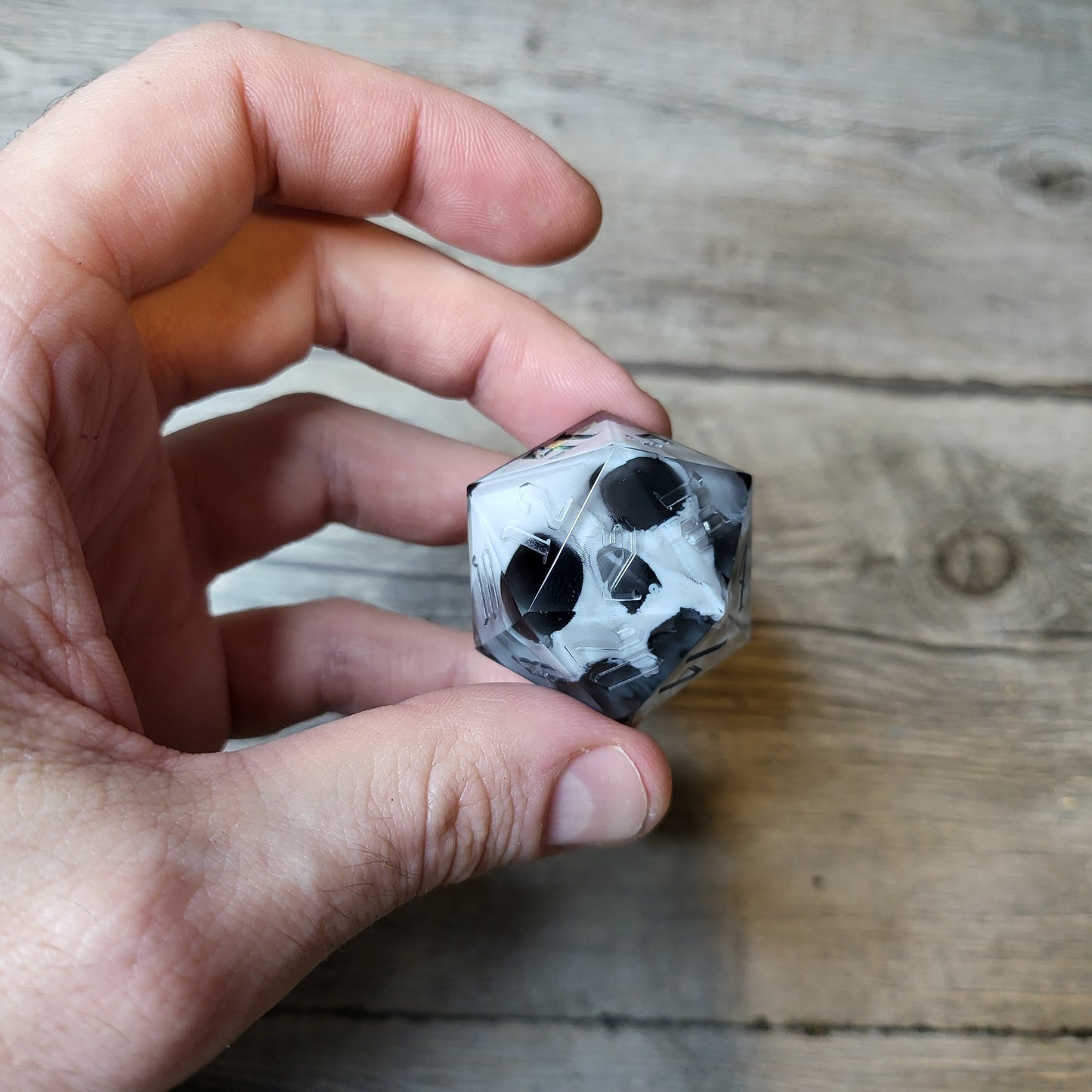 D20 dice in 33 mm format with skull inside for role-playing games for Dungeons and Dragons