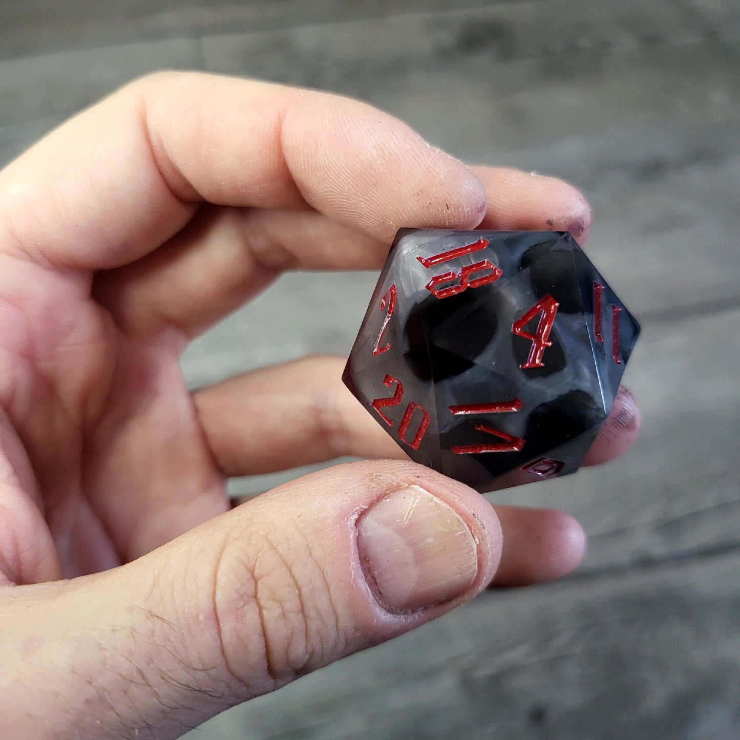 D20 dice in 33 mm format with skull inside for role-playing games for Dungeons and Dragons