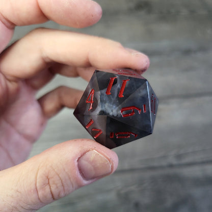 D20 dice in 33 mm format with skull inside for role-playing games for Dungeons and Dragons