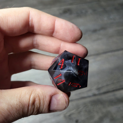 D20 dice in 33 mm format with skull inside for role-playing games for Dungeons and Dragons