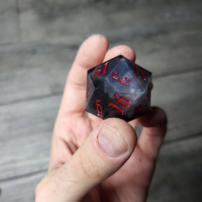 D20 dice in 33 mm format with skull inside for role-playing games for Dungeons and Dragons