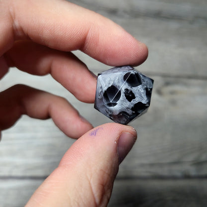 Dice D20 with skull inside for role playing for Dungeons and Dragons