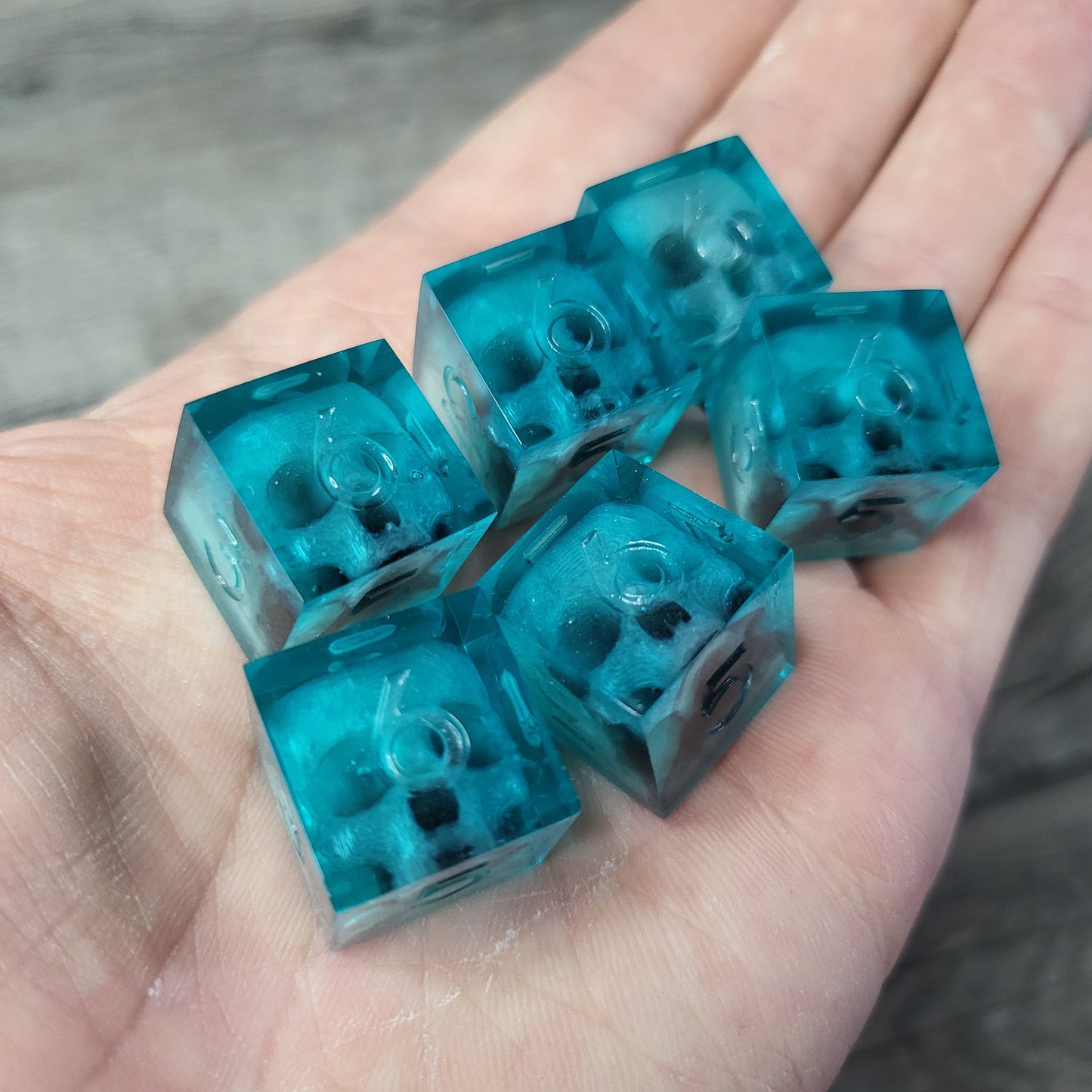 Dice set in D6 format with skull inside for role-playing games for Dungeons and Dragons