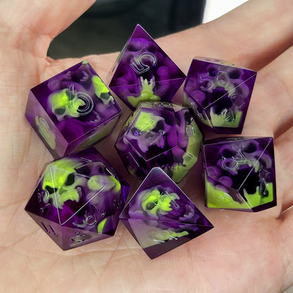 Purple resin DnD dice set with neon green skulls inside