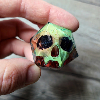 D20 dice in 33 mm format with skull inside for role-playing games for Dungeons and Dragons