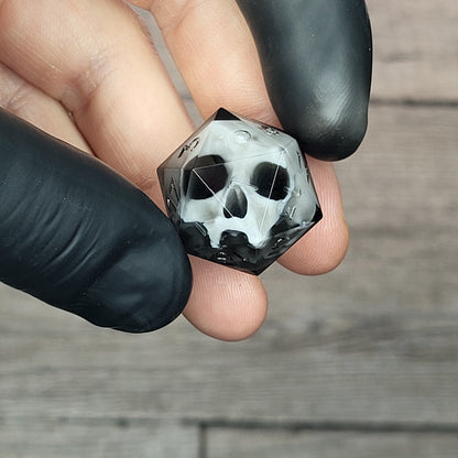 d20 dice for playing Dungeons and Dragons with a white skull and black resin