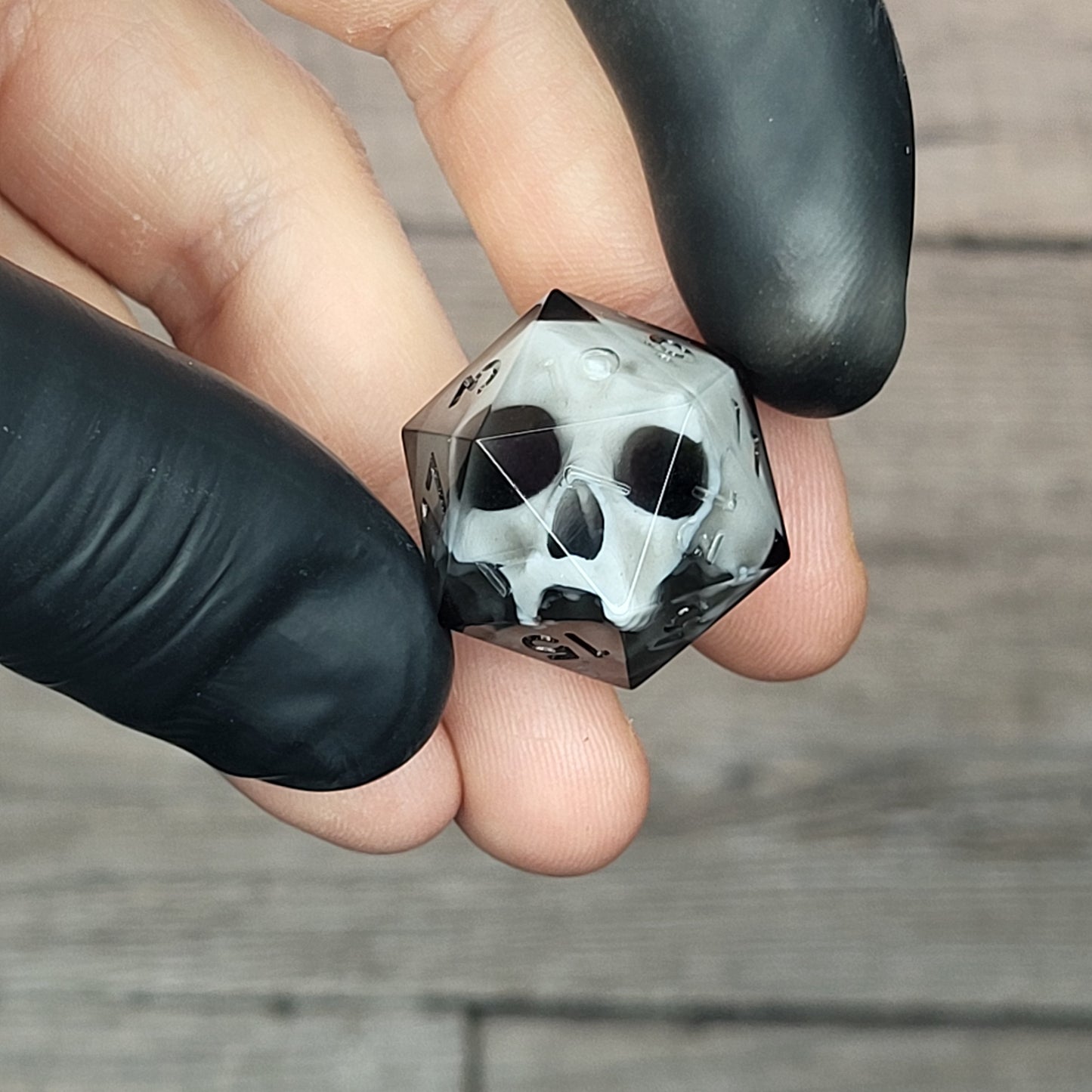 d20 dice for playing Dungeons and Dragons with a white skull and black resin