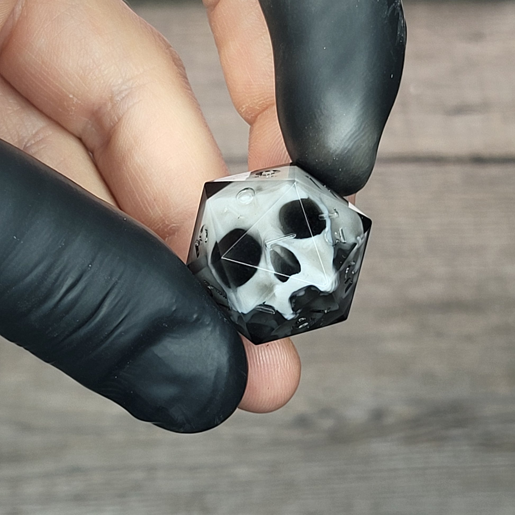 d20 dice for playing Dungeons and Dragons with a white skull and black resin