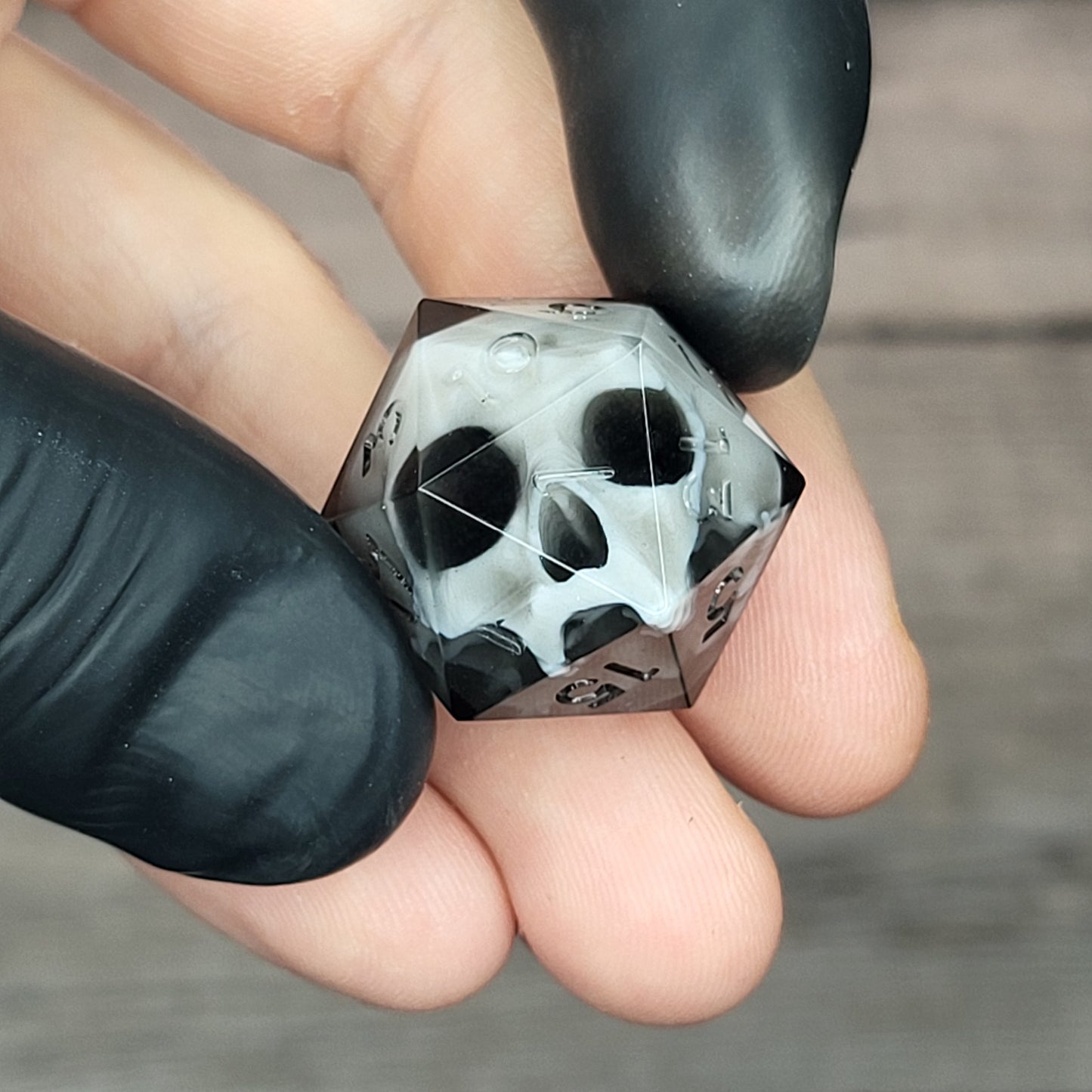 d20 dice for playing Dungeons and Dragons with a white skull and black resin