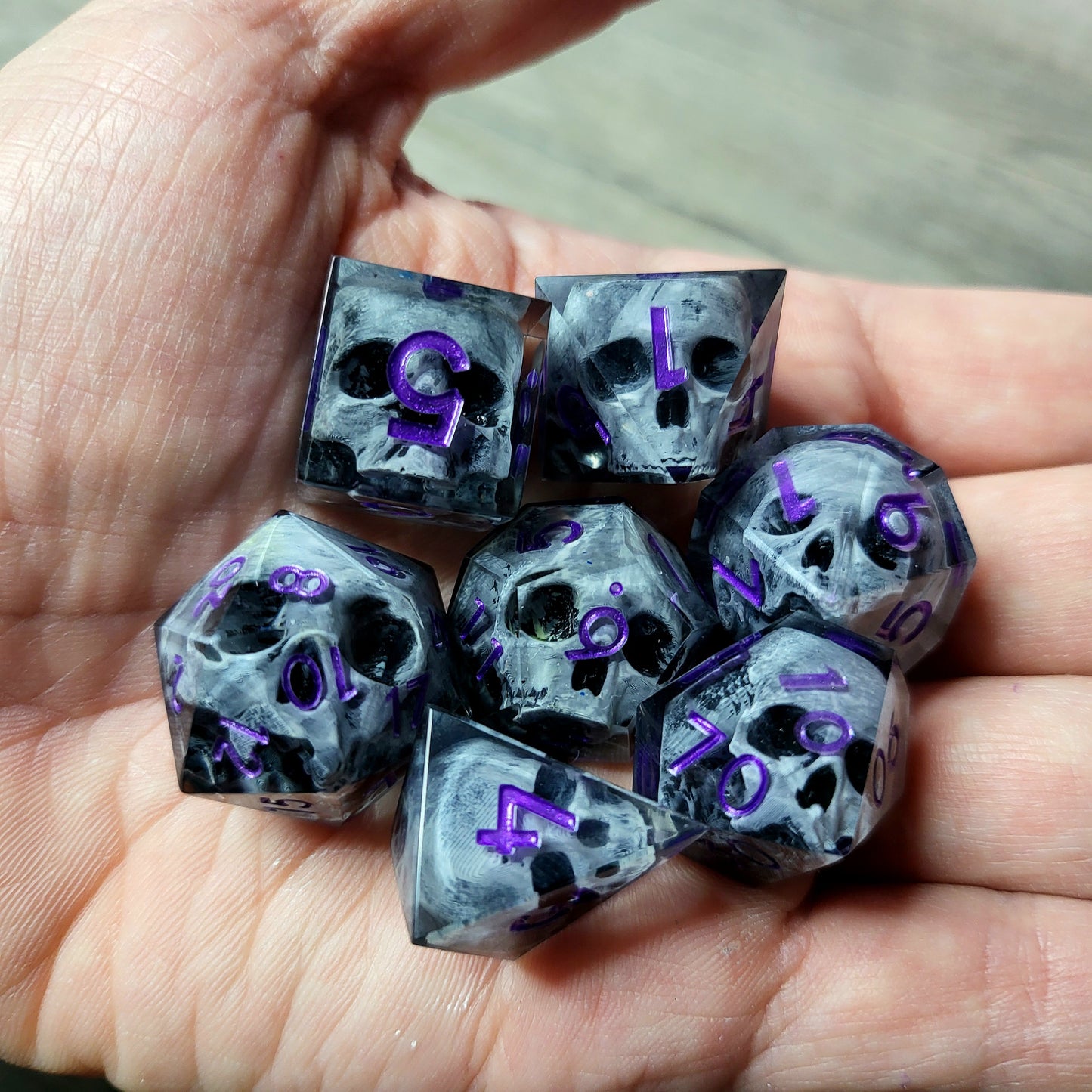 Dice set with 7 pieces with skull inside for role-playing games for Dungeons and Dragons