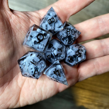 Dice set with 7 pieces with skull inside in spirit theme for role-playing games for Dungeons and Dragons