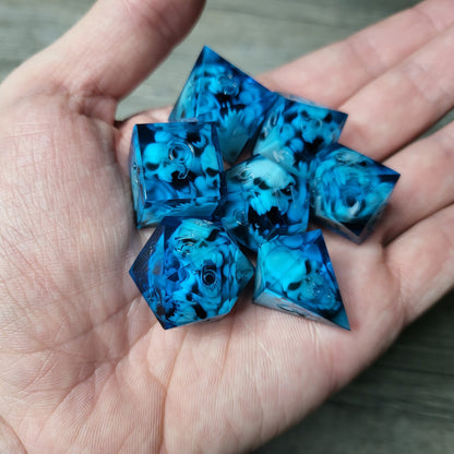 Dice set with 7 pieces with skull inside in spirit theme for role-playing games for Dungeons and Dragons