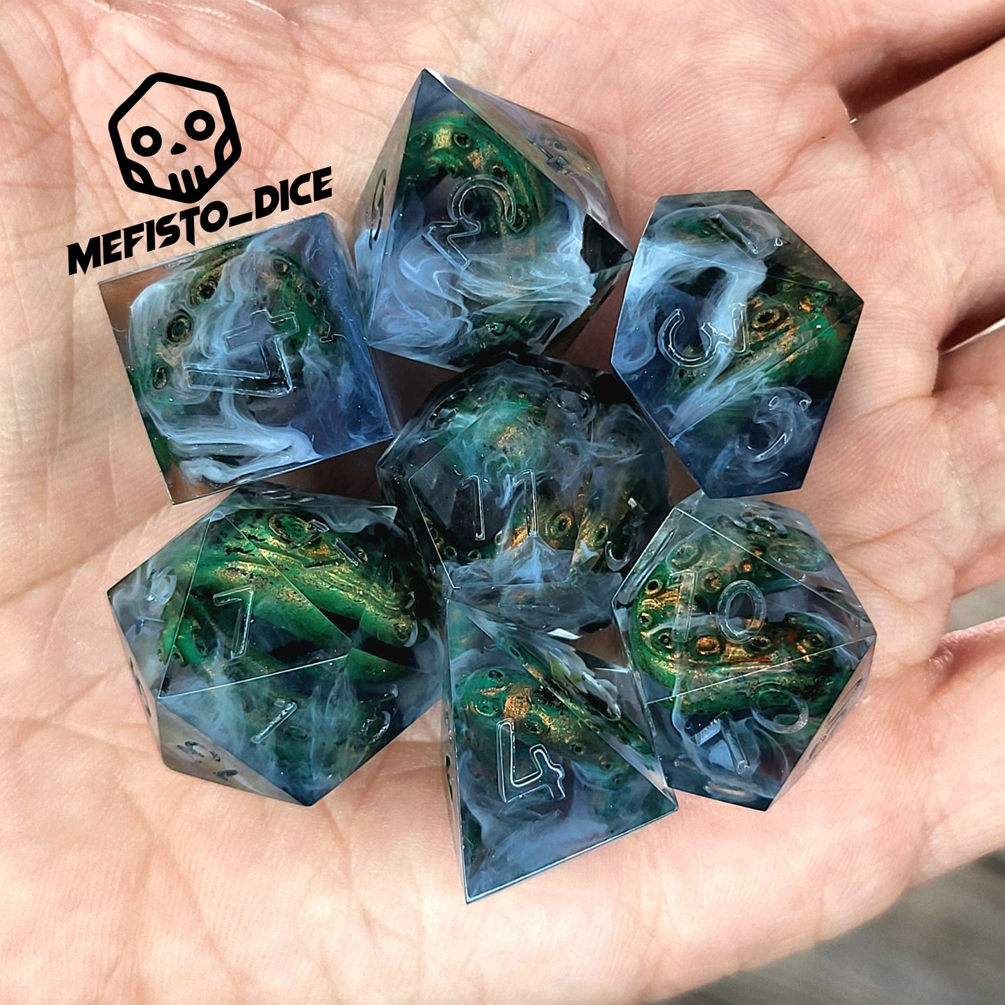 Clear resin DnD dice set with green and gold tentacles inside surrounded by white smoke effects