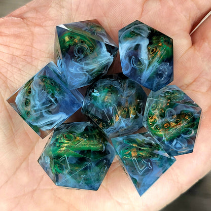 Clear resin DnD dice set with green and gold tentacles inside surrounded by white smoke effects