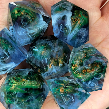 Clear resin DnD dice set with green and gold tentacles inside surrounded by white smoke effects