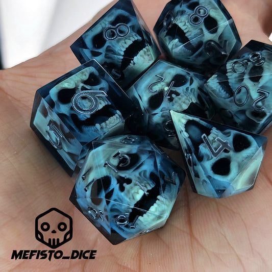 Close-up of black resin dice with mint-green undead zombie skulls and dark metallic silver numbers, handcrafted by Mefisto_Dice.